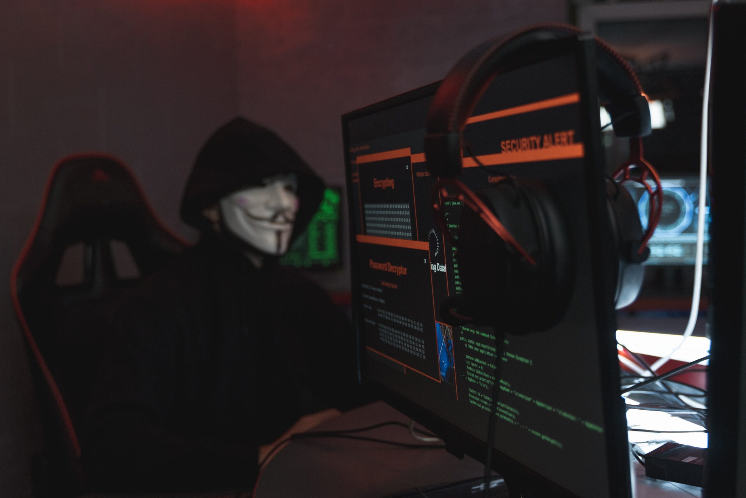 person with a mask and, computer screens