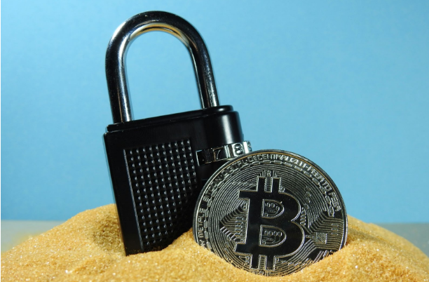 a padlock and a bitcoin