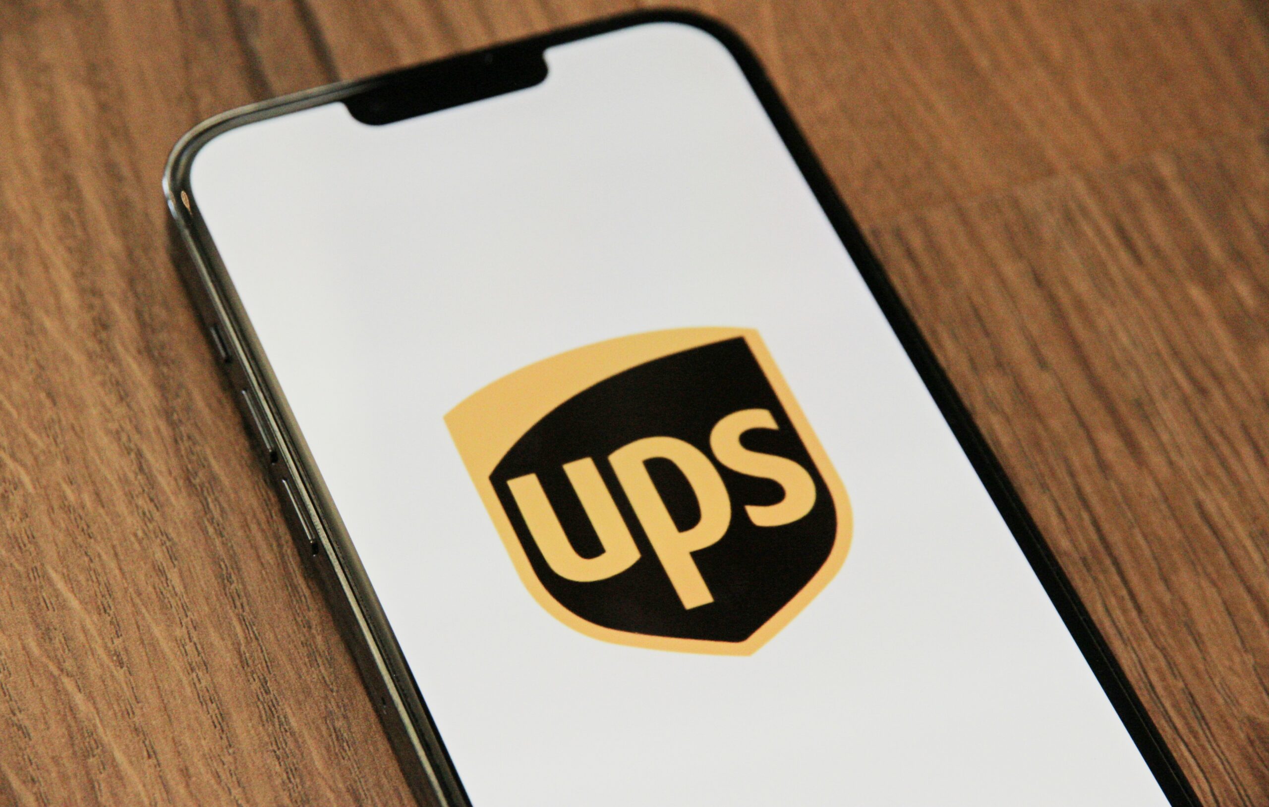 smartphone displaying the UPS logo on its screen