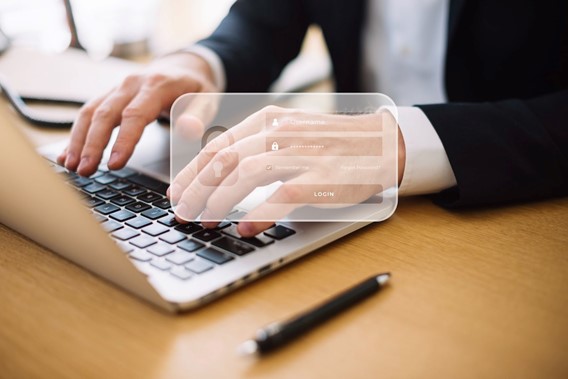 Businessman logging in on laptop with virtual security interface