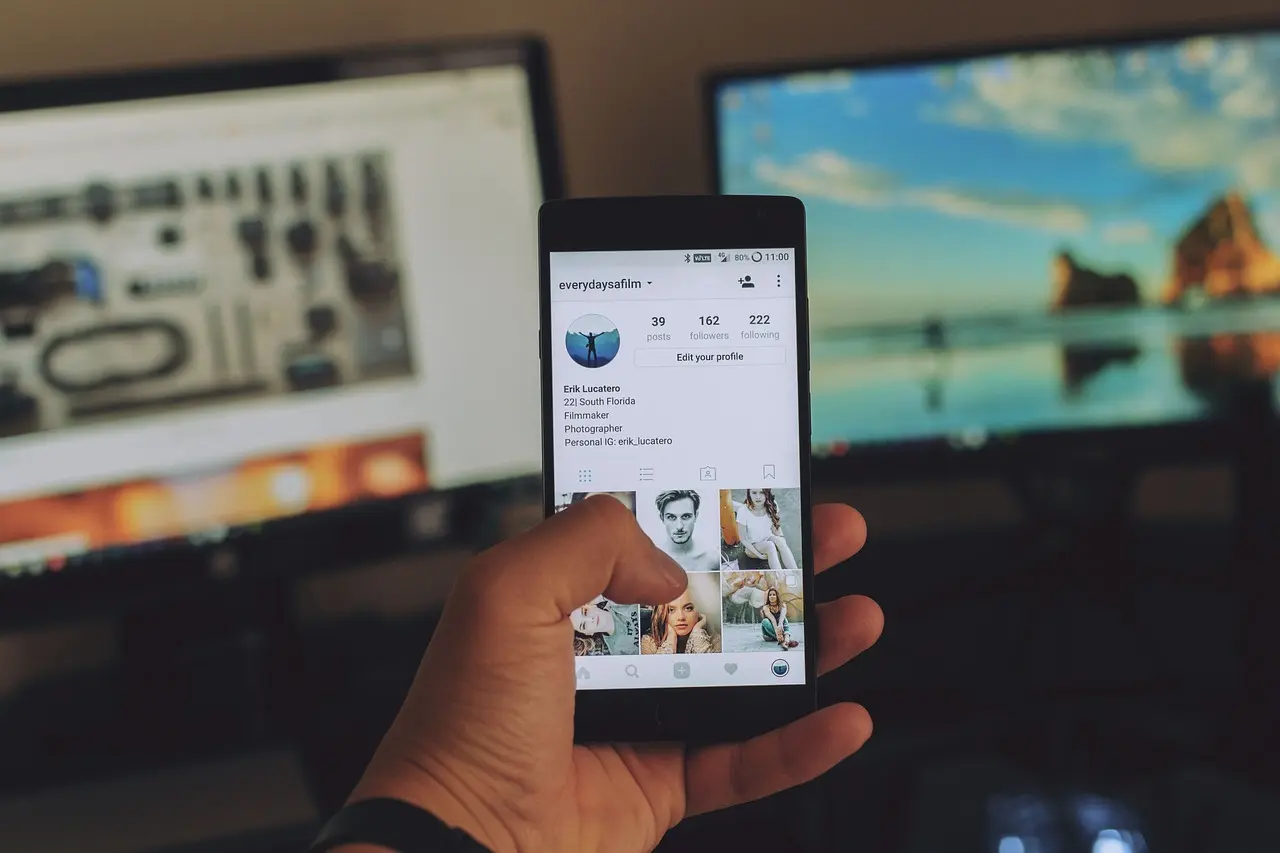 User scrolling Instagram on smartphone, showing the need for how to check a fake profile to avoid scams and identity thef