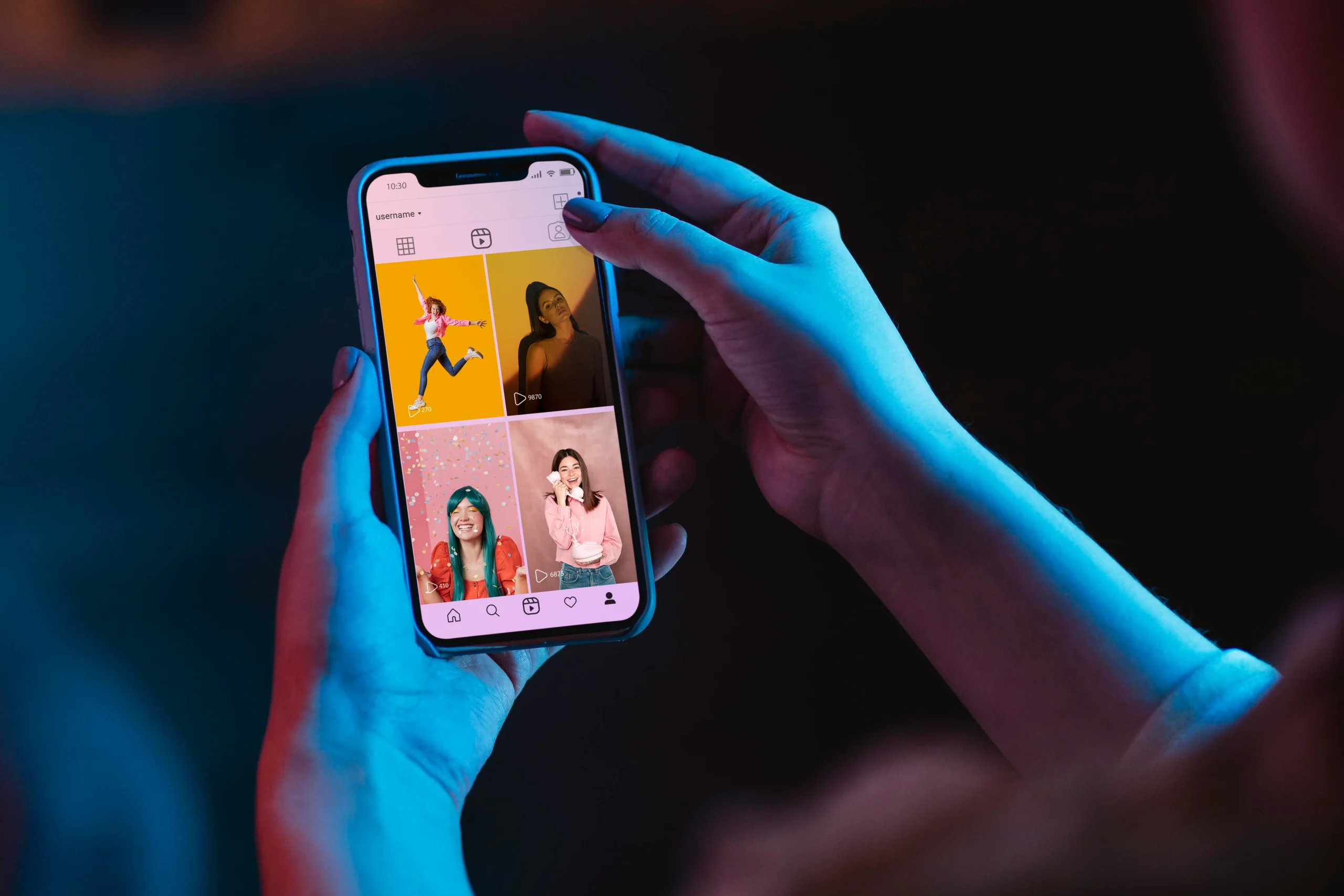 Person using a smartphone showing a profile that could belong to a TikTok scammer girl