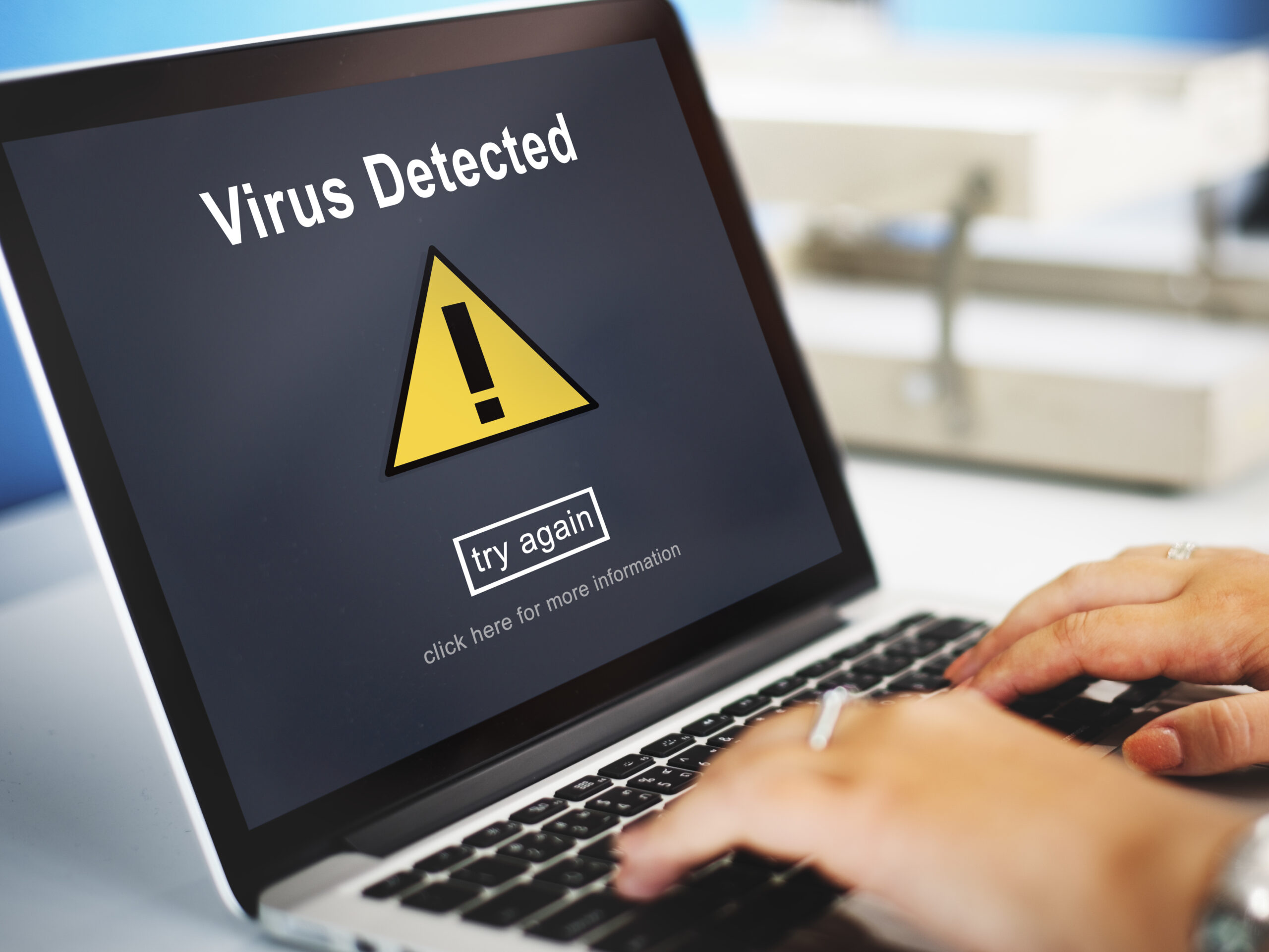 Example of how to check if your computer has a virus after a detection alert on a laptop screen