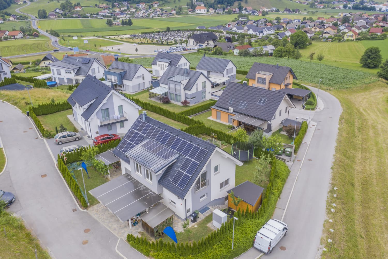 14567 (1) Aerial view of modern homes with solar panels in a residential neighborhood